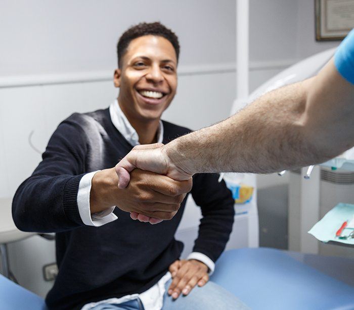 Man shaking hands with his dentist