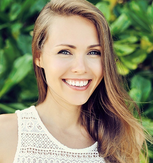 Woman with gorgeous smile after crown lengthening