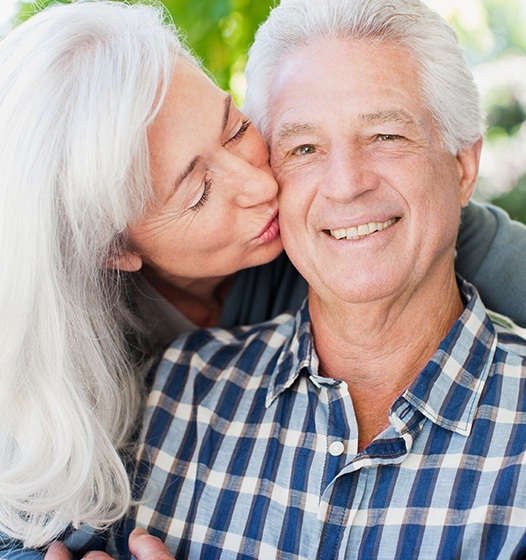 Man smiling after full mouth rehabilitation