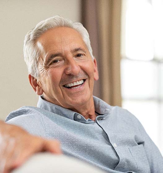 man smiling after getting dental implants in Sunnyvale