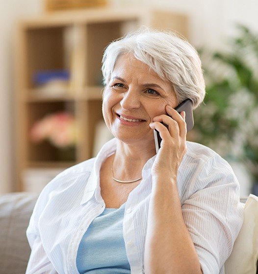 Woman discussing bone grating and sinus surgery with periodontist