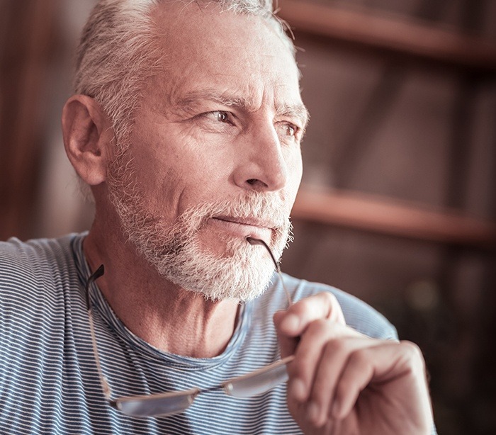 Man contemplating the need for periodontal care